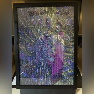 Completed framed peacock diamond art with glue sealant